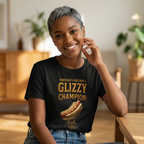 Person wearing a black t-shirt with 'Fantasy Football Glizzy Champion' text and hot dog graphic, sitting indoors.