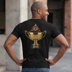 Man wearing a black t-shirt with a gold trophy and poop emoji on the back, standing outdoors.