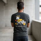 Person wearing a black t-shirt with a graphic design on the back, standing in an indoor setting.