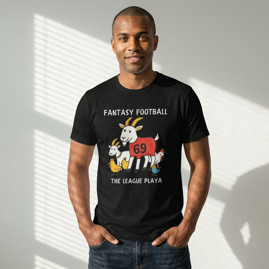 Man wearing a black t-shirt with a graphic design and text, standing against a light background.