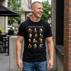 Man wearing a black t-shirt with colorful graphics and text, standing outdoors.