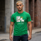 Man wearing a green t-shirt with a graphic design and text, standing outdoors.